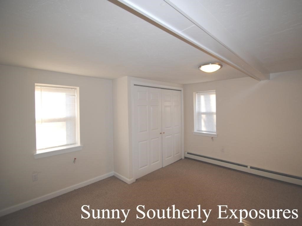 16 Hartness Road, Unit B Sutton, MA 01590 - Photo 8 of 16 an empty room with windows