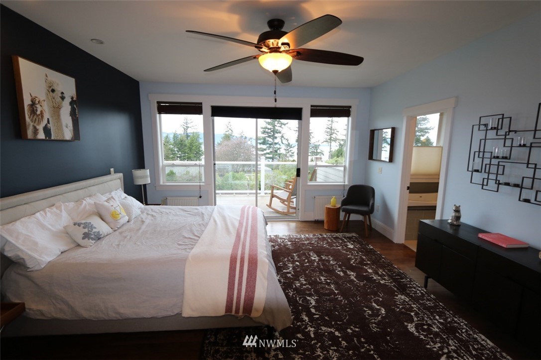 530 Briar Road Bellingham, WA 98225 - Photo 12 of 40 a bedroom with a bed and a chandelier