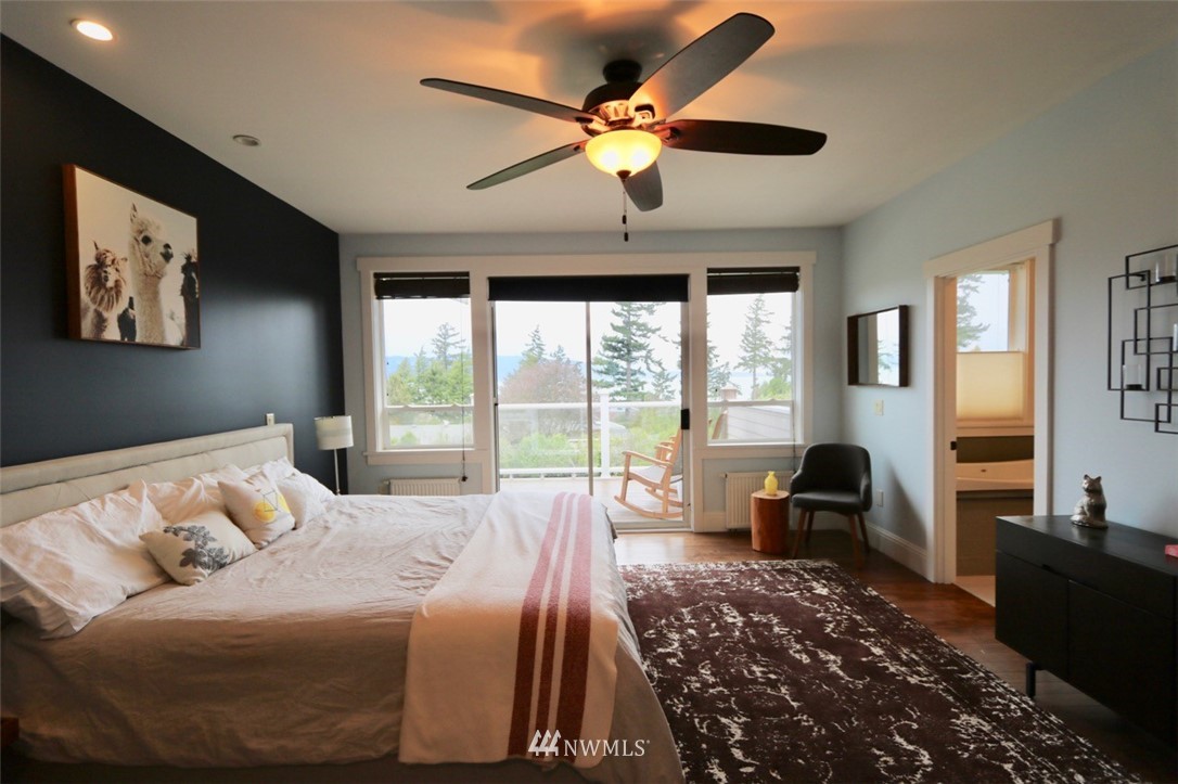 530 Briar Road Bellingham, WA 98225 - Photo 14 of 40 a bedroom with a large bed and a large window