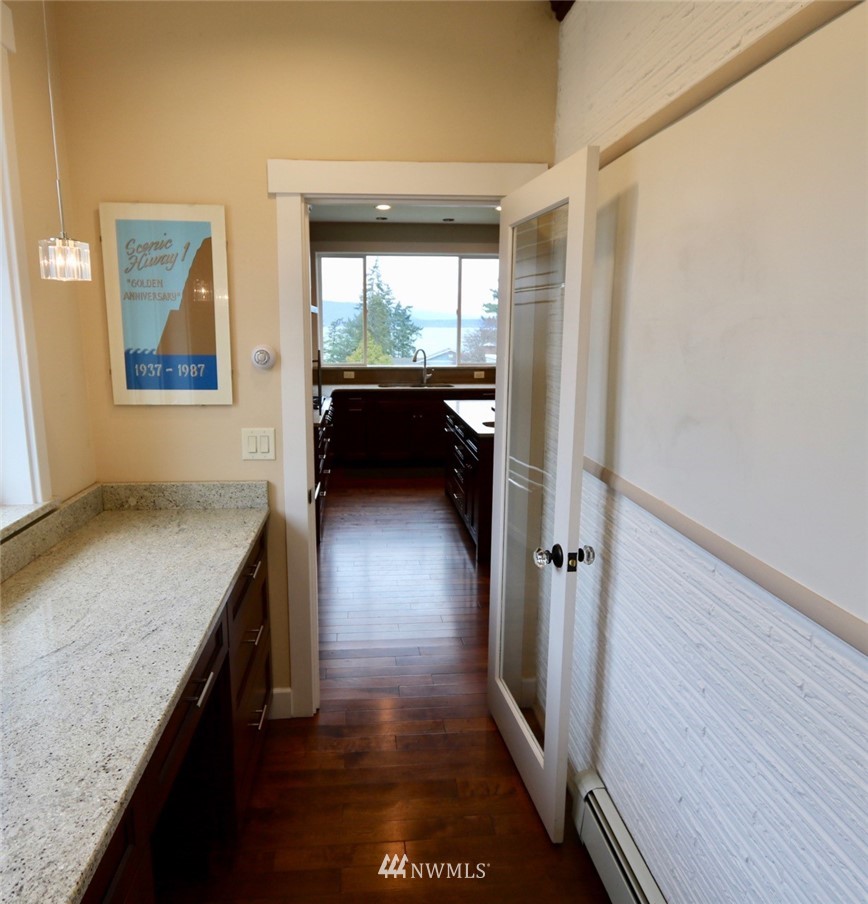 530 Briar Road Bellingham, WA 98225 - Photo 21 of 40 a view of hallway with wooden floor and chandelier