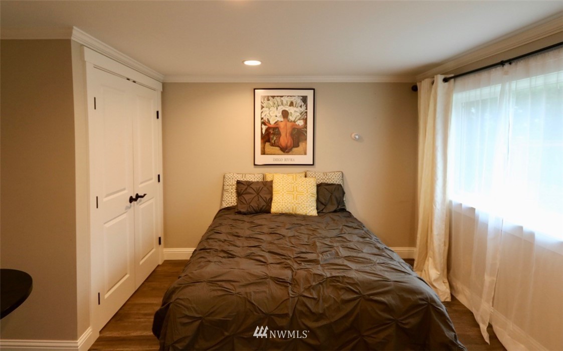 530 Briar Road Bellingham, WA 98225 - Photo 30 of 40 a bedroom with a bed and painting on the wall