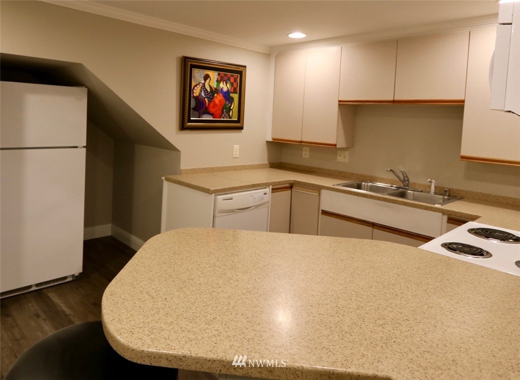 530 Briar Road Bellingham, WA 98225 - Photo 32 of 40 a kitchen with a sink a stove and a refrigerator