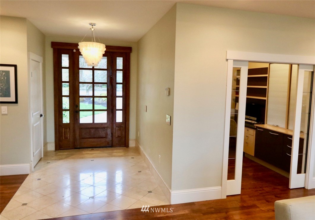 530 Briar Road Bellingham, WA 98225 - Photo 6 of 40 a view of empty room with wooden floor and windows