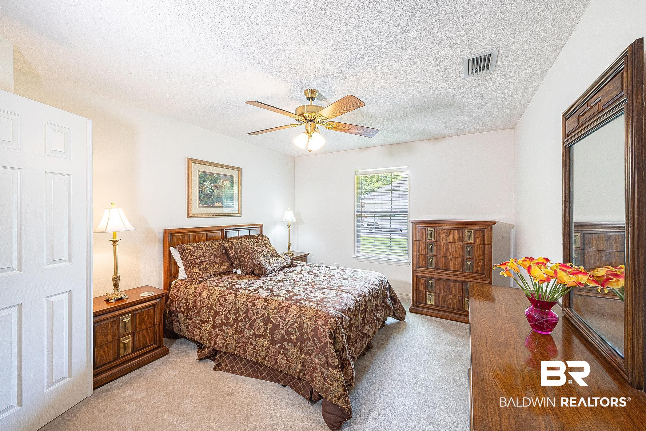 16154 Parke Boulevard Foley, AL 36535 - Photo 31 of 44 Carpeted bedroom featuring a textured ceiling and ceiling fan