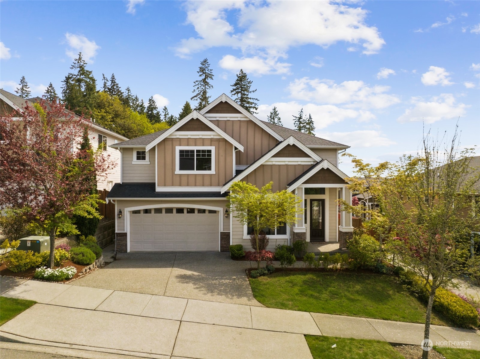 4114 222nd Place Southeast Bothell, WA 98021 - Photo 1 of 39 a front view of a house with garden