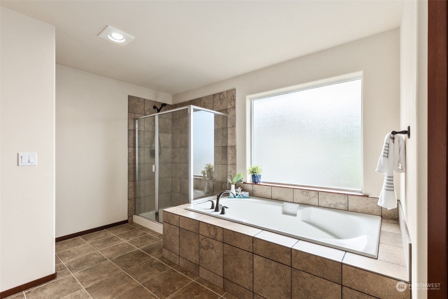 4114 222nd Place Southeast Bothell, WA 98021 - Photo 21 of 39 a bathroom with a bathtub and a sink