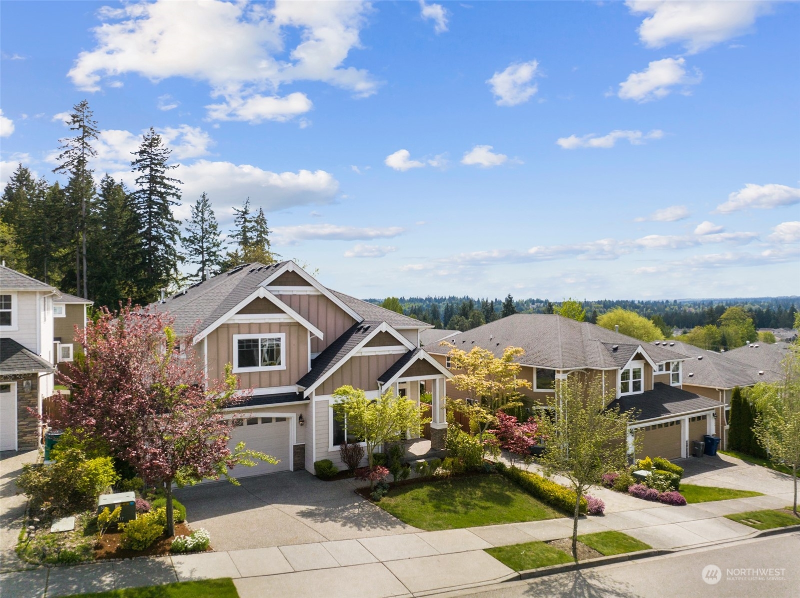 4114 222nd Place Southeast Bothell, WA 98021 - Photo 33 of 39 a front view of a house with a garden