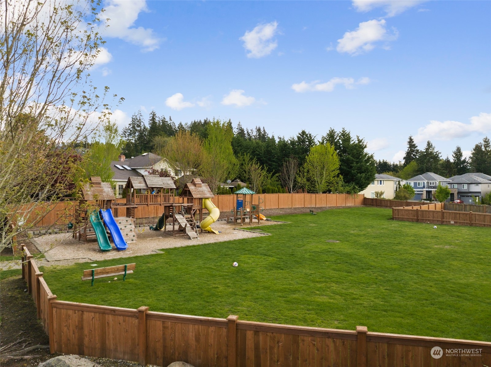 4114 222nd Place Southeast Bothell, WA 98021 - Photo 38 of 39 a view of a park with swings and slides