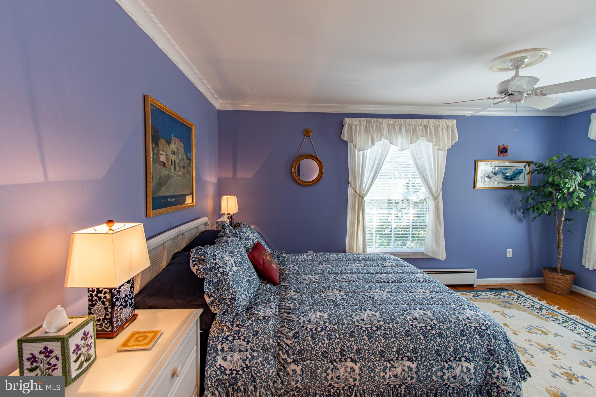 5995 Elston Shore Road Neavitt, MD 21652 - Photo 19 of 42 Serene blue-hued bedroom retreat.