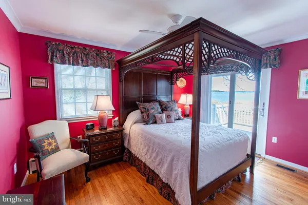 a bed room with a bed and a chair