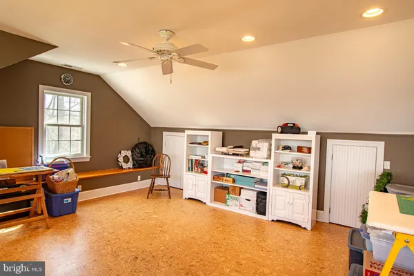 a living room with lots of furniture and gym equipment