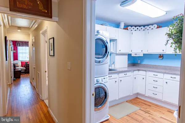 a view of a hallway with washer and dryer