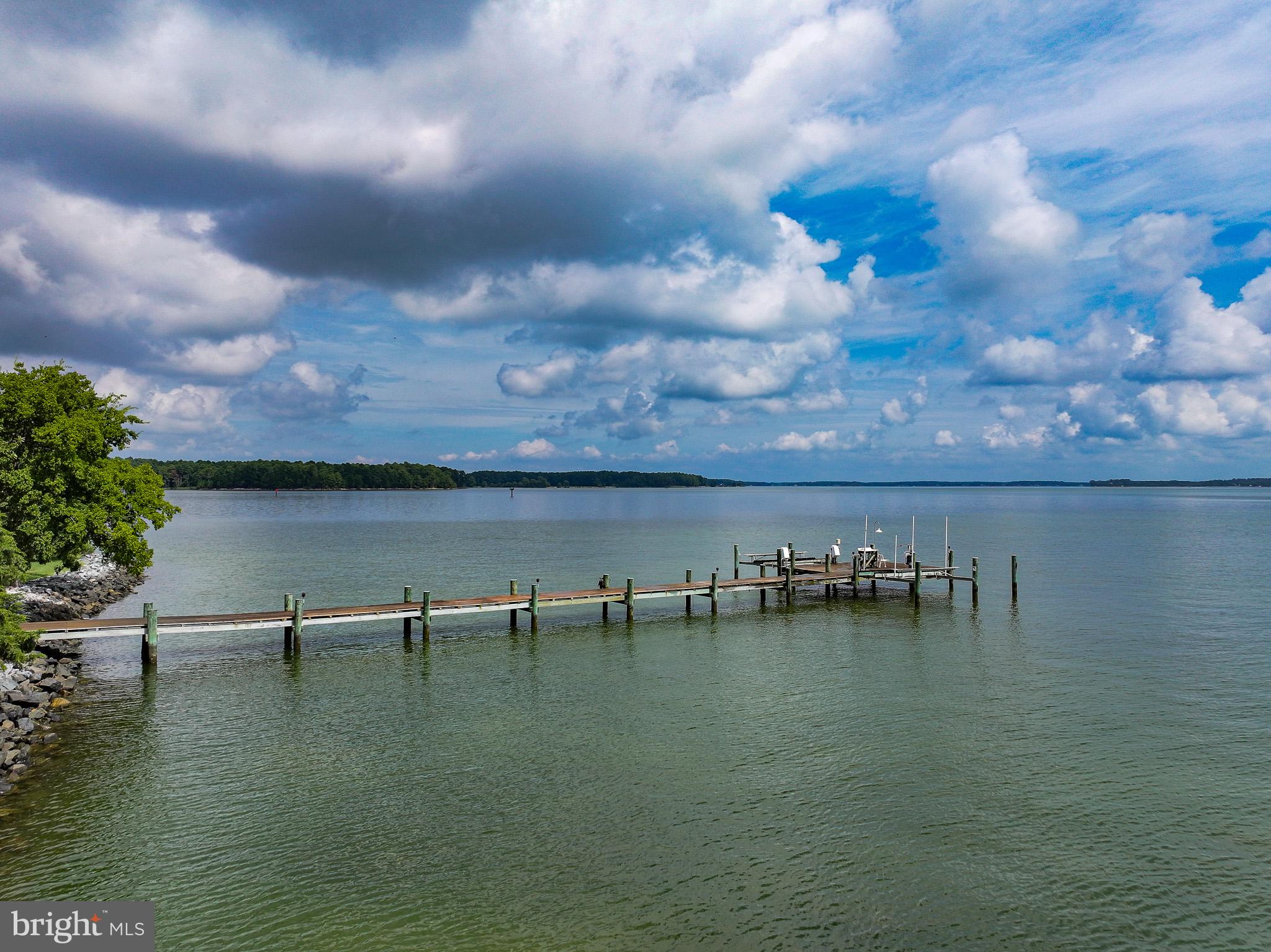 5995 Elston Shore Road Neavitt, MD 21652 - Photo 38 of 42 Tranquil dock by serene waterscape.