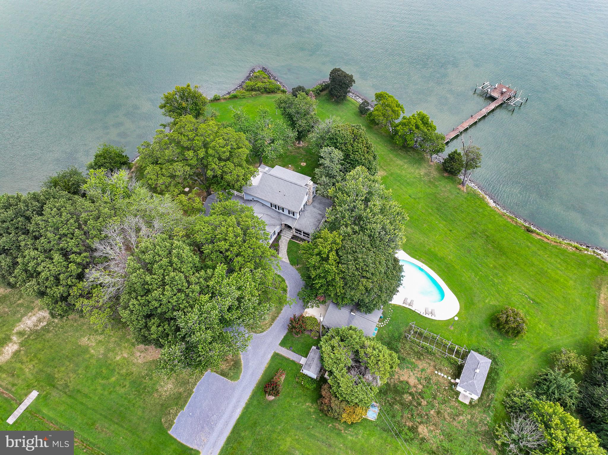 5995 Elston Shore Road Neavitt, MD 21652 - Photo 8 of 42 Lakeside retreat with lush greenery.