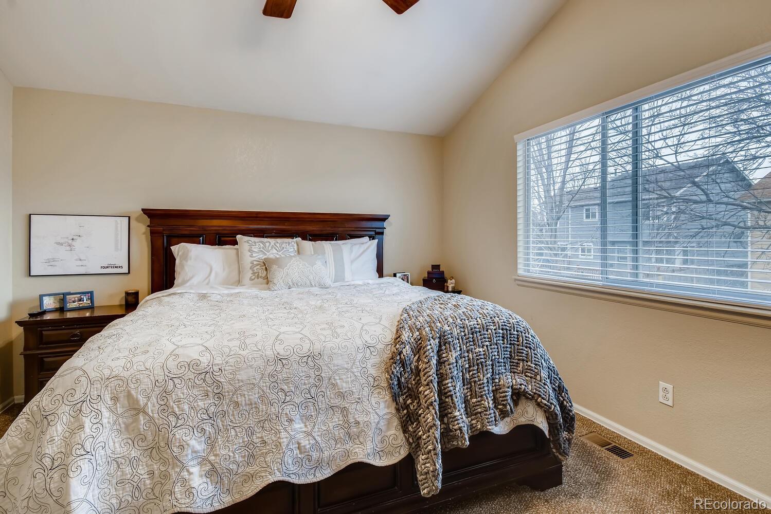 13173 Raritan Street Westminster, CO 80234 - Photo 12 of 28 a bedroom with a bed and a window
