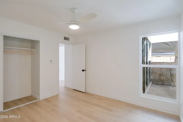 a view of an empty room with a bathroom