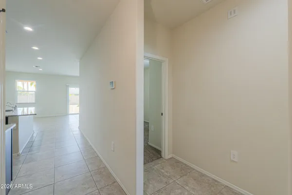 a view of hallway with a window and a mirror