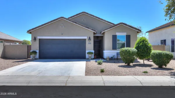 a front view of a house with garage