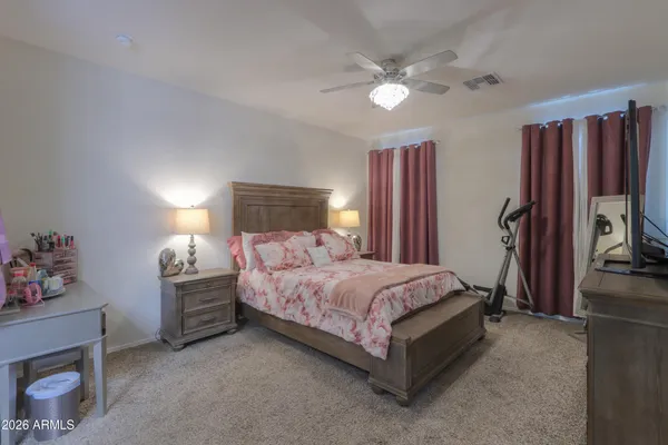 a bed room with a bed and a tv