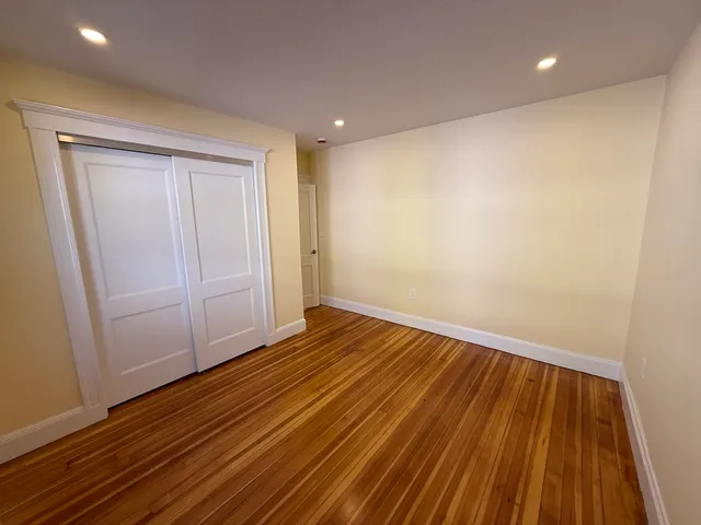 a view of wooden floor in an empty room