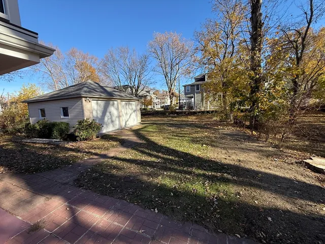 a view of a yard with car parked
