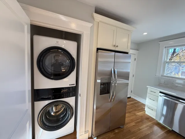 a kitchen with a washer and dryer in it