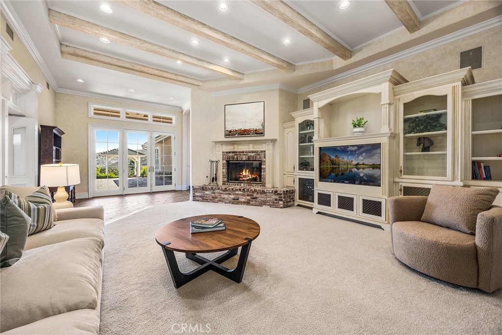 2112 Indian Creek Road Diamond Bar, CA 91765 - Photo 11 of 72 a living room with furniture flat screen tv and a fireplace