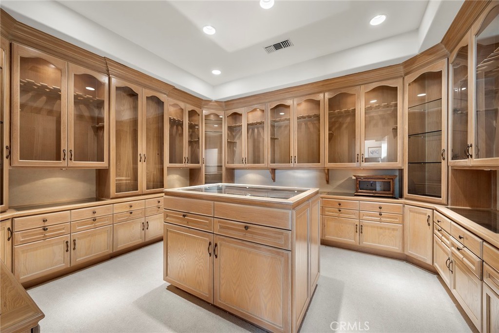 2112 Indian Creek Road Diamond Bar, CA 91765 - Photo 22 of 72 a large white kitchen with granite countertop a sink and white cabinets