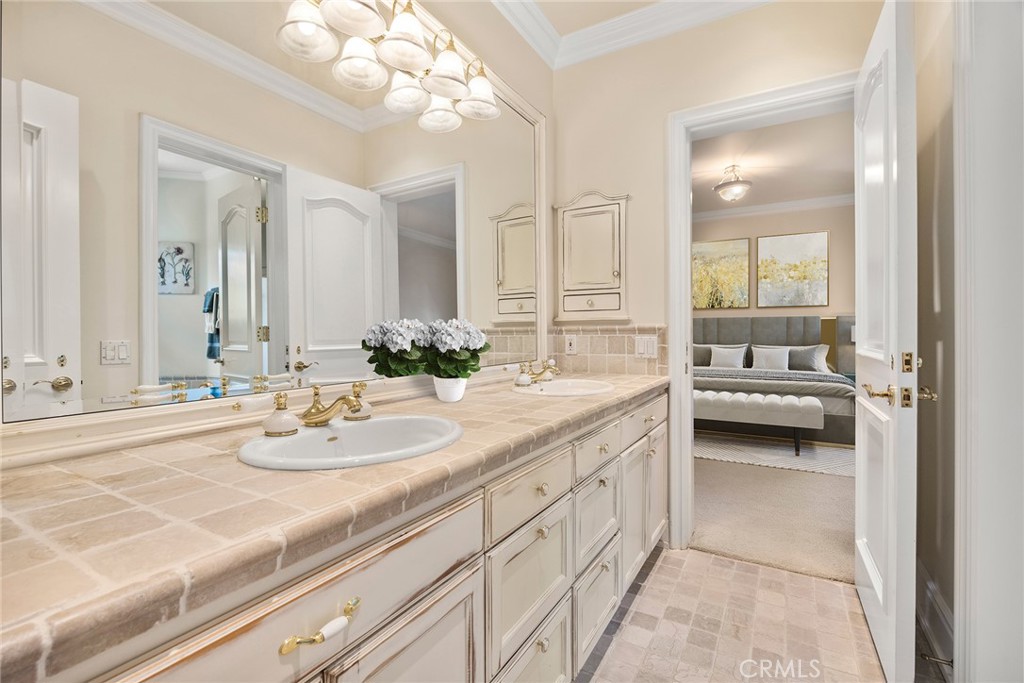 2112 Indian Creek Road Diamond Bar, CA 91765 - Photo 24 of 72 a en suite bathroom with a double sink and mirror