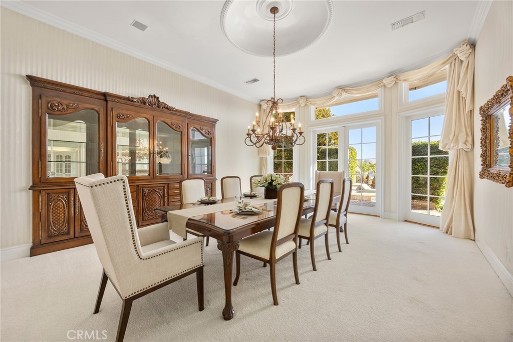 2112 Indian Creek Road Diamond Bar, CA 91765 - Photo 10 of 72 a dining room with furniture a chandelier and wooden floor