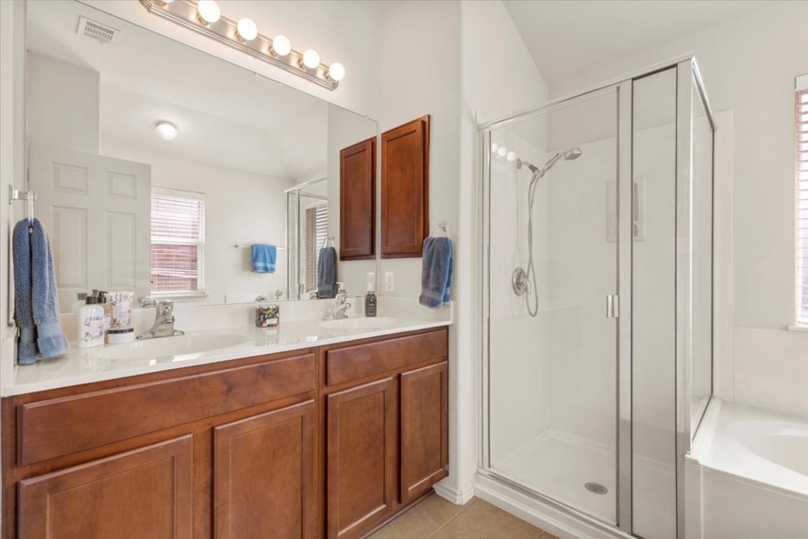 12500 Timber Heights Drive Austin, TX 78754 - Photo 17 of 31 a bathroom with a double vanity sink mirror and double