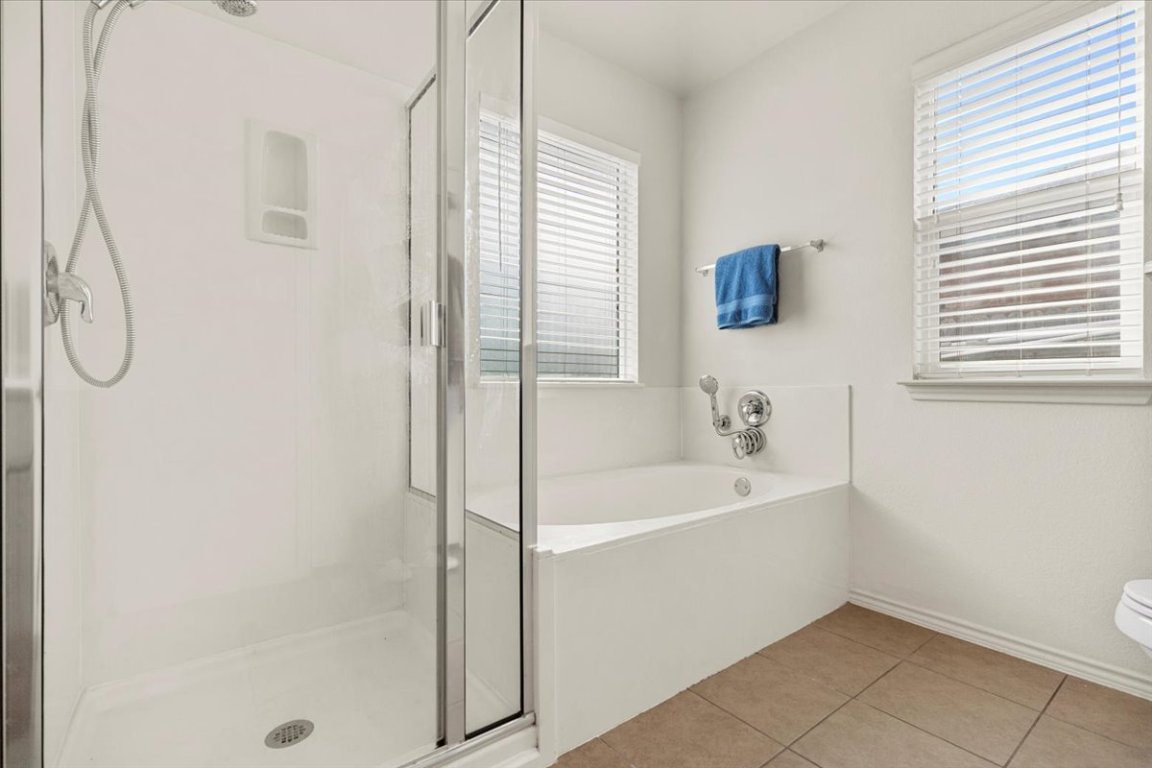 12500 Timber Heights Drive Austin, TX 78754 - Photo 18 of 31 a white bath tub sitting next to a shower