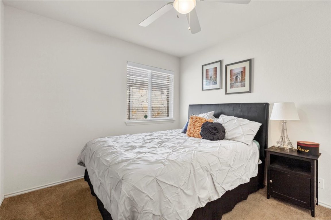 12500 Timber Heights Drive Austin, TX 78754 - Photo 19 of 31 a bedroom with a bed and a window