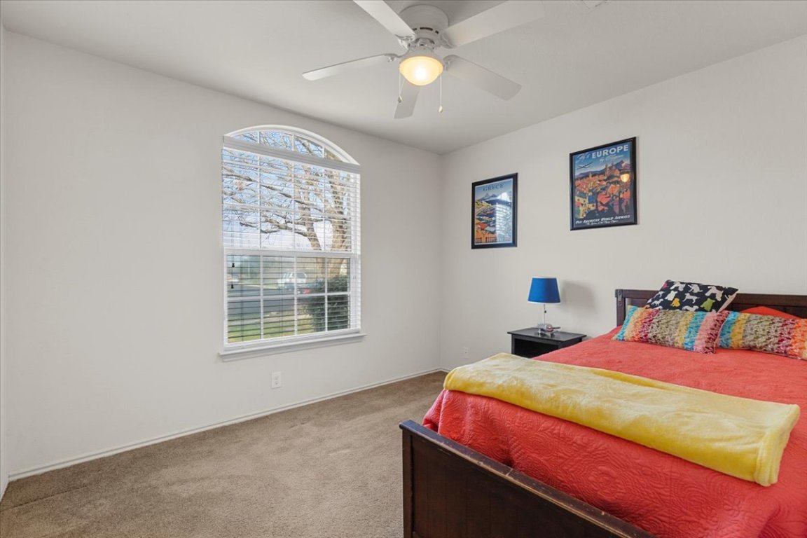 12500 Timber Heights Drive Austin, TX 78754 - Photo 21 of 31 a bedroom with a bed and a window