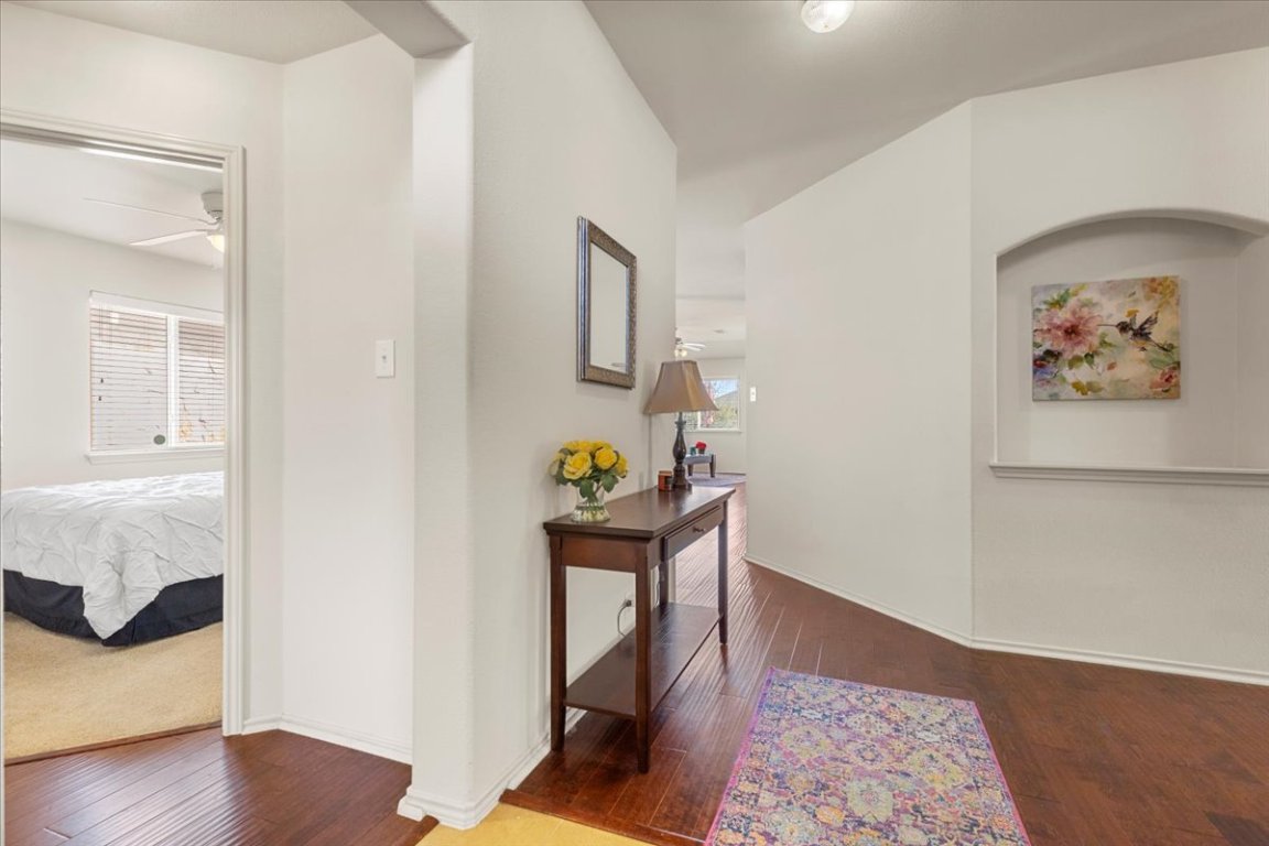 12500 Timber Heights Drive Austin, TX 78754 - Photo 4 of 31 a workspace with furniture and wooden floor