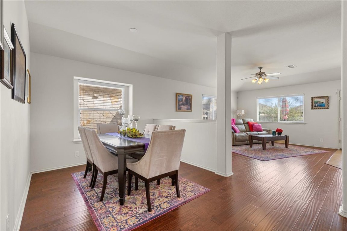 12500 Timber Heights Drive Austin, TX 78754 - Photo 5 of 31 a view of a dining room with furniture and a wooden floor