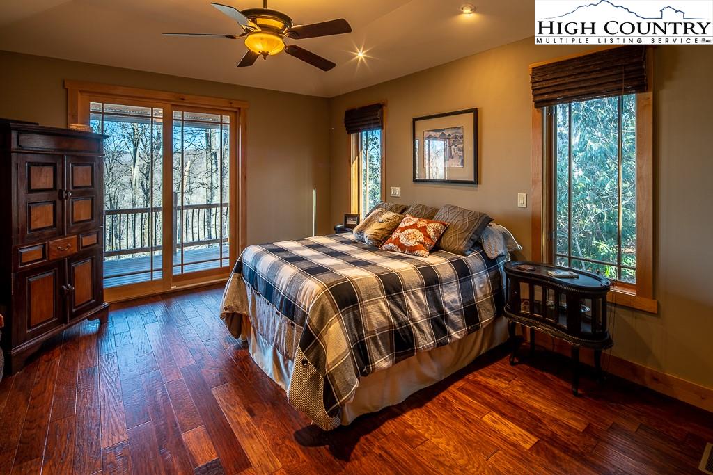 612 Bear Cubs Trail Boone, NC 28607 - Photo 18 of 37 a bed sitting in a bedroom next to a window