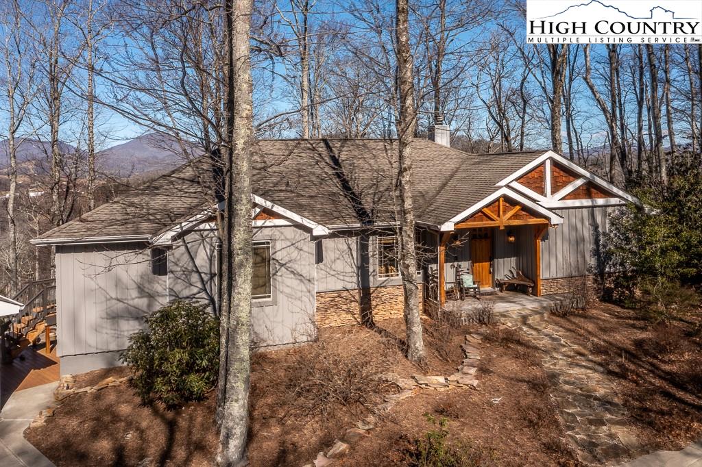 612 Bear Cubs Trail Boone, NC 28607 - Photo 2 of 37 a view of a house with a yard and wooden fence