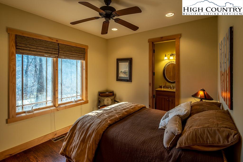 612 Bear Cubs Trail Boone, NC 28607 - Photo 23 of 37 a bedroom with a bed and window