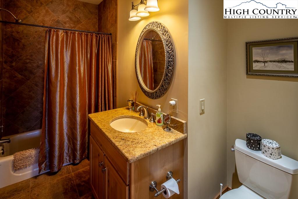 612 Bear Cubs Trail Boone, NC 28607 - Photo 26 of 37 a bathroom with a sink and a mirror
