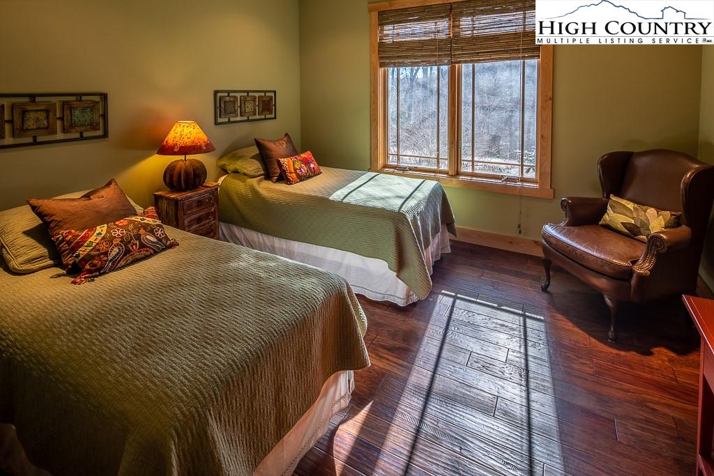 612 Bear Cubs Trail Boone, NC 28607 - Photo 28 of 37 a bedroom with double bed and a window