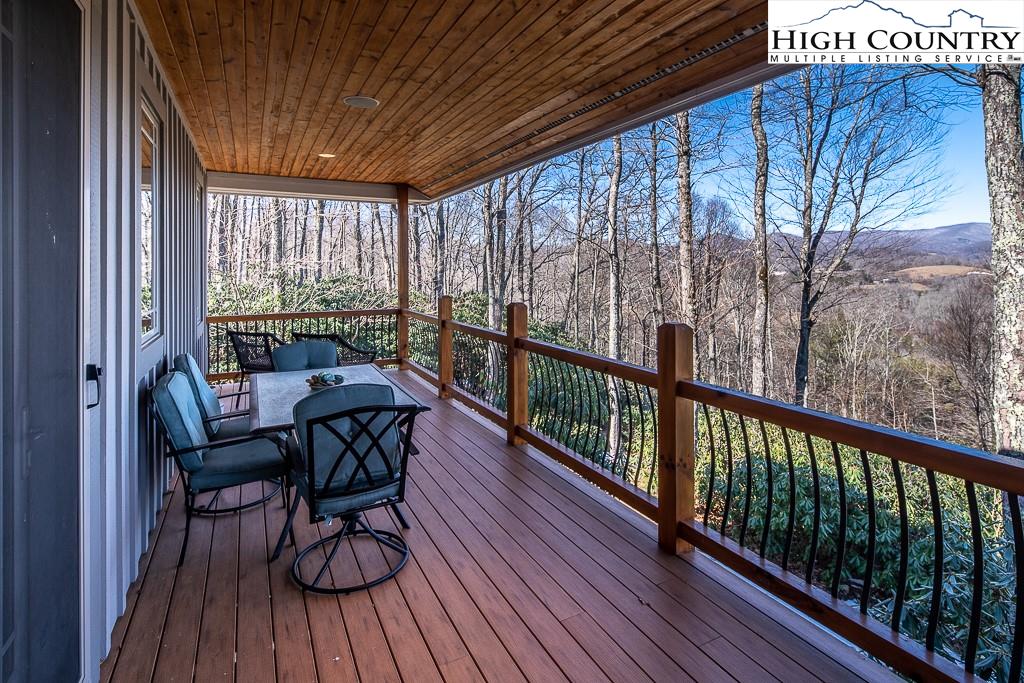 612 Bear Cubs Trail Boone, NC 28607 - Photo 4 of 37 a view of balcony with wooden floor and outdoor seating
