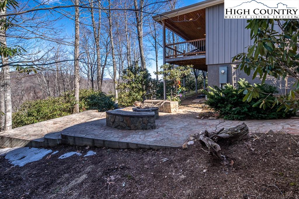 612 Bear Cubs Trail Boone, NC 28607 - Photo 5 of 37 a view of a porch with furniture and plants