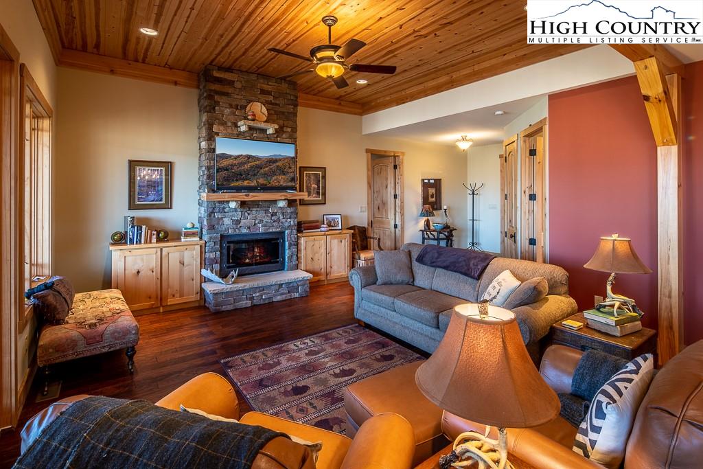 612 Bear Cubs Trail Boone, NC 28607 - Photo 9 of 37 a living room with furniture fireplace and a fireplace