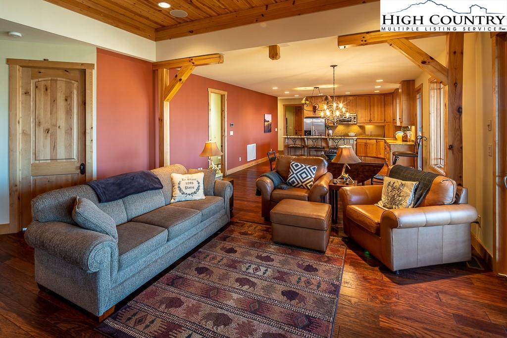 612 Bear Cubs Trail Boone, NC 28607 - Photo 10 of 37 a living room with furniture and a chandelier