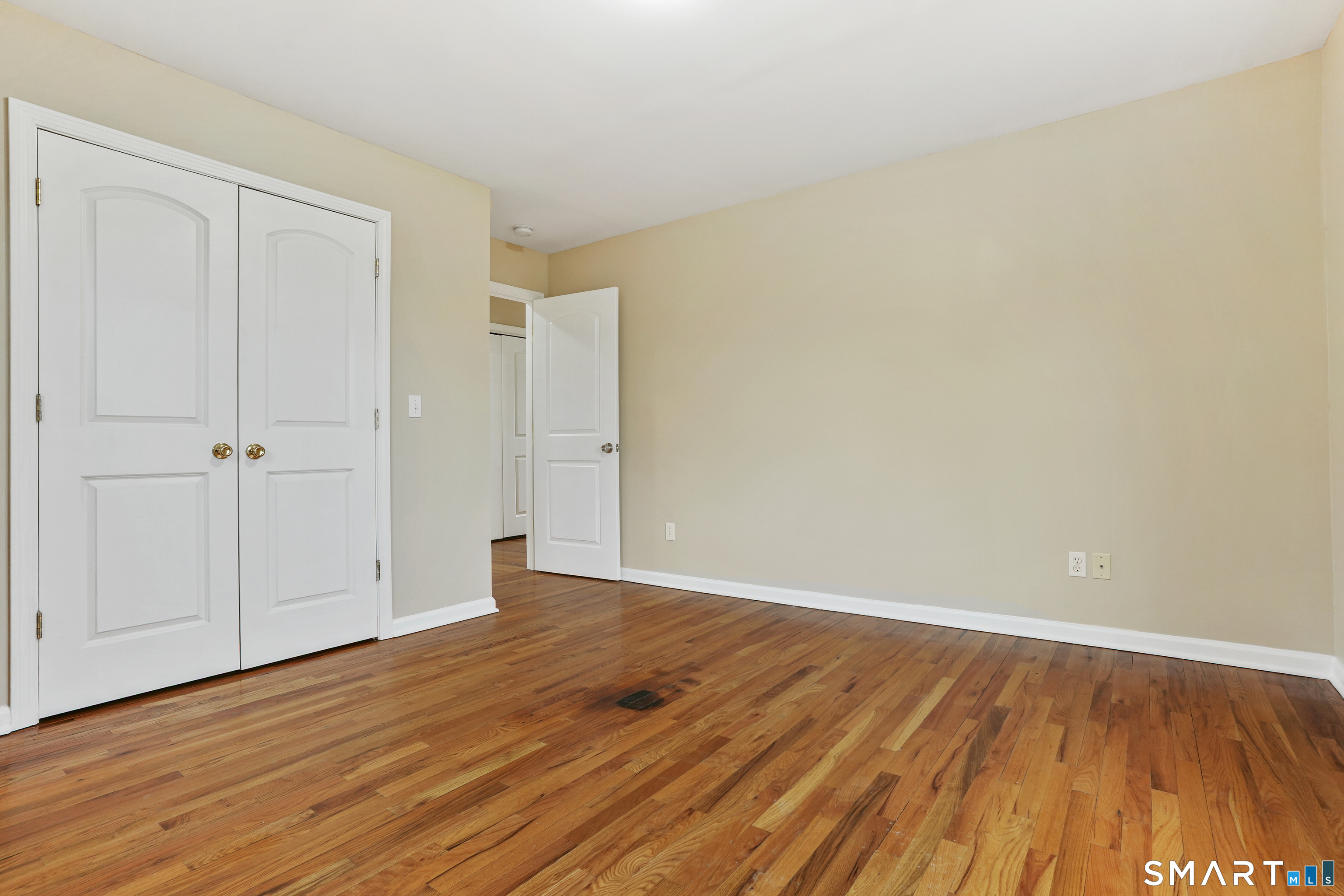 1180 Main Street Stratford, CT 06615 - Photo 13 of 22 a view of an empty room with wooden floor