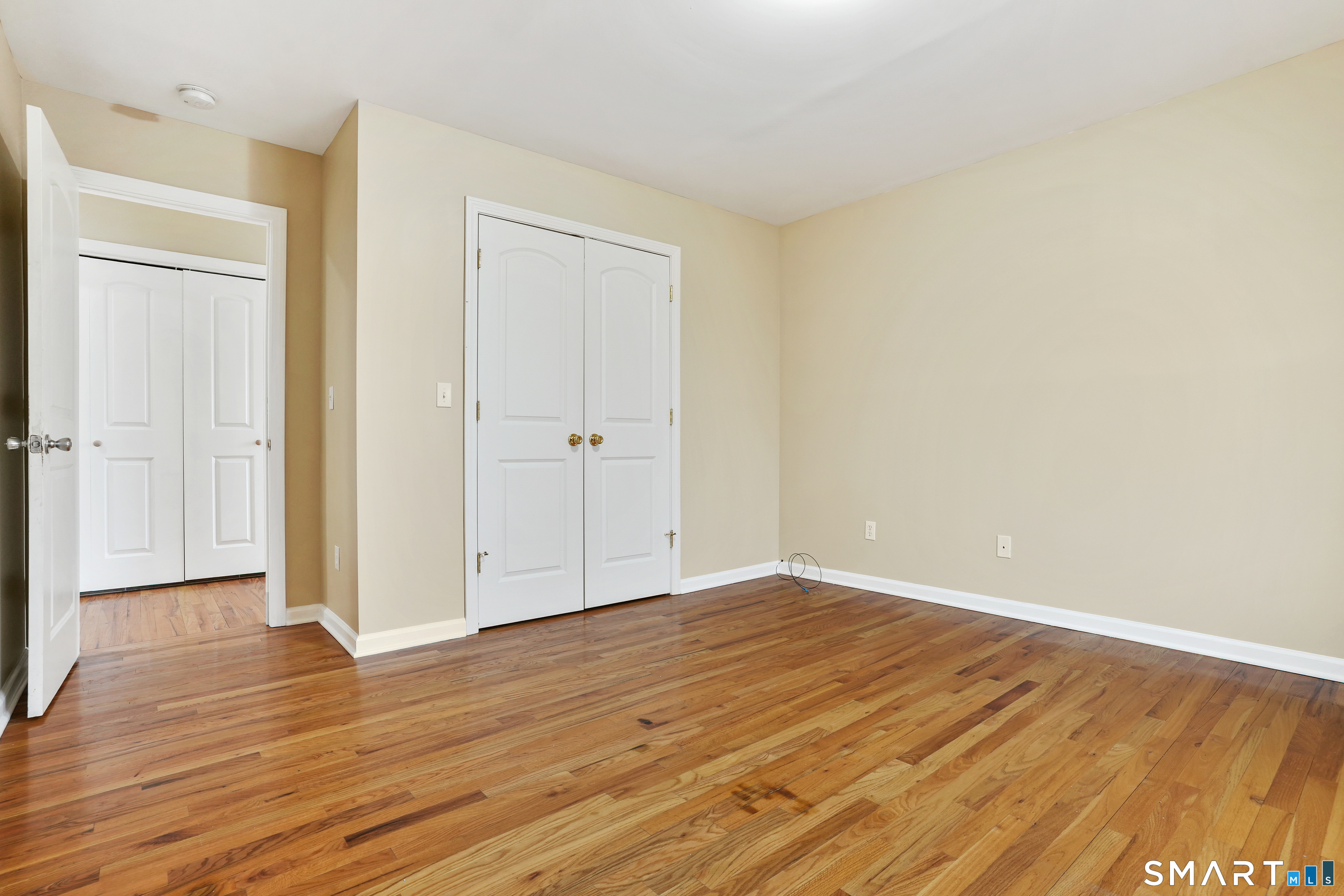 1180 Main Street Stratford, CT 06615 - Photo 14 of 22 a view of an empty room with wooden floor