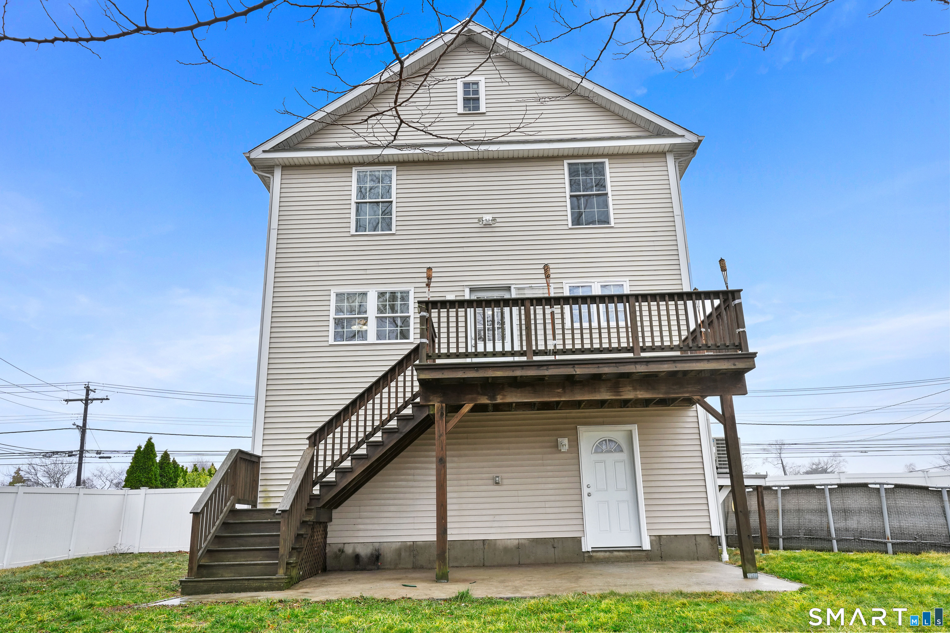 1180 Main Street Stratford, CT 06615 - Photo 21 of 22 a front view of a house with a yard