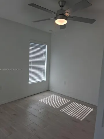 a view of an empty room with a window