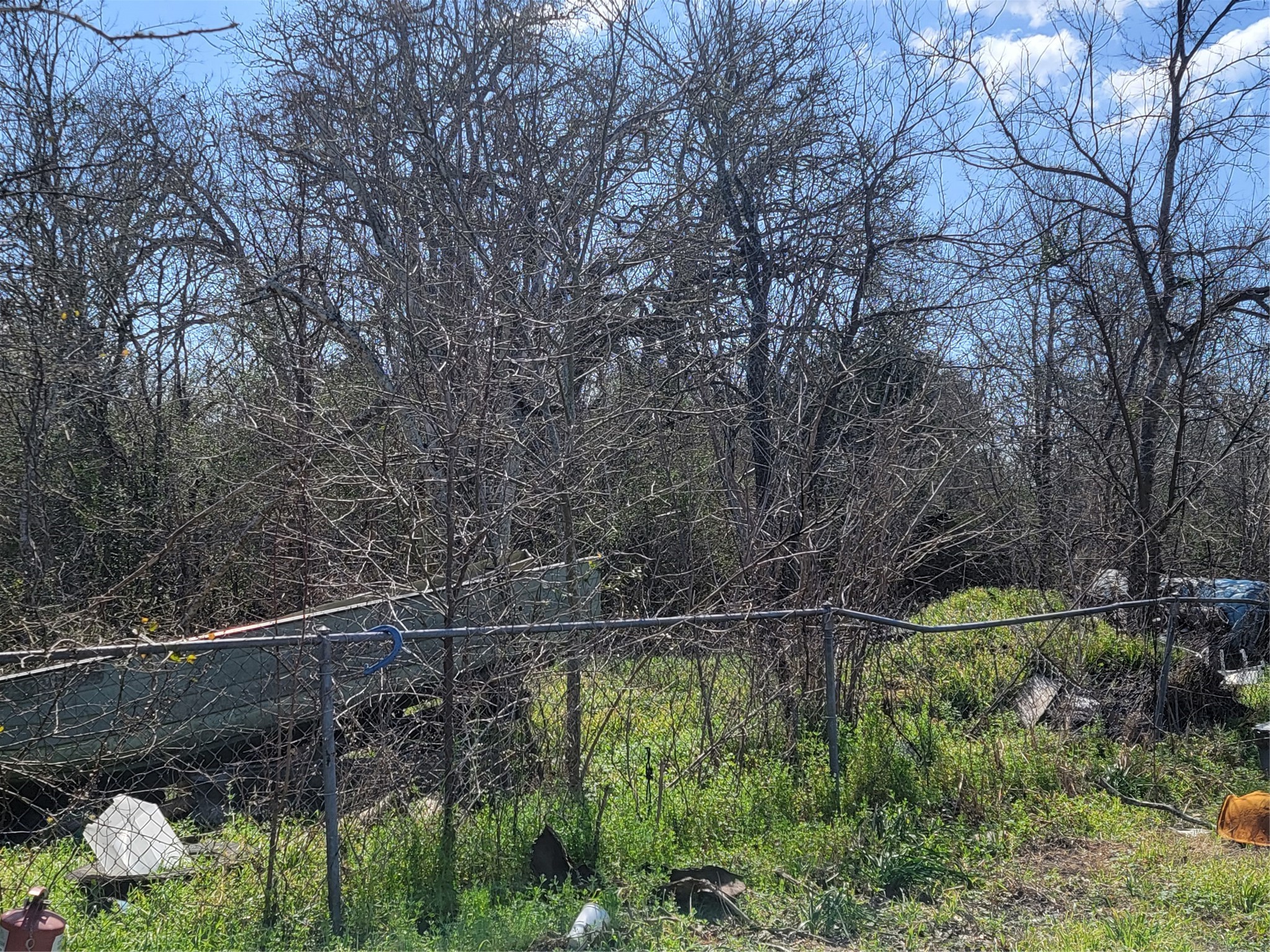 6431 220th La Grange, TX 78945 - Photo 2 of 5 a backyard of a house with lots of green space and a water fountain